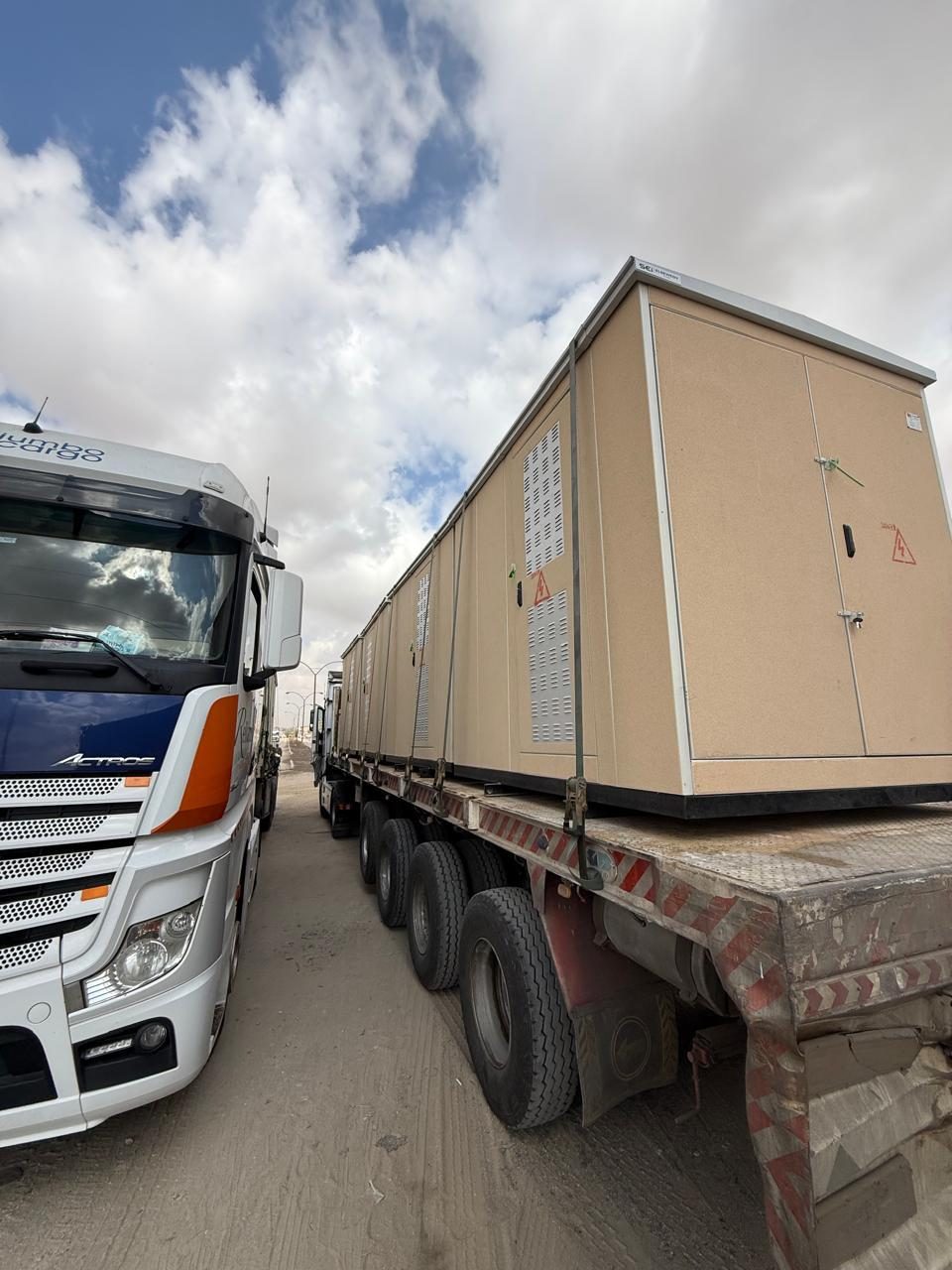 Medium-voltage compact substation (kiosk) loaded on a truck for site delivery
